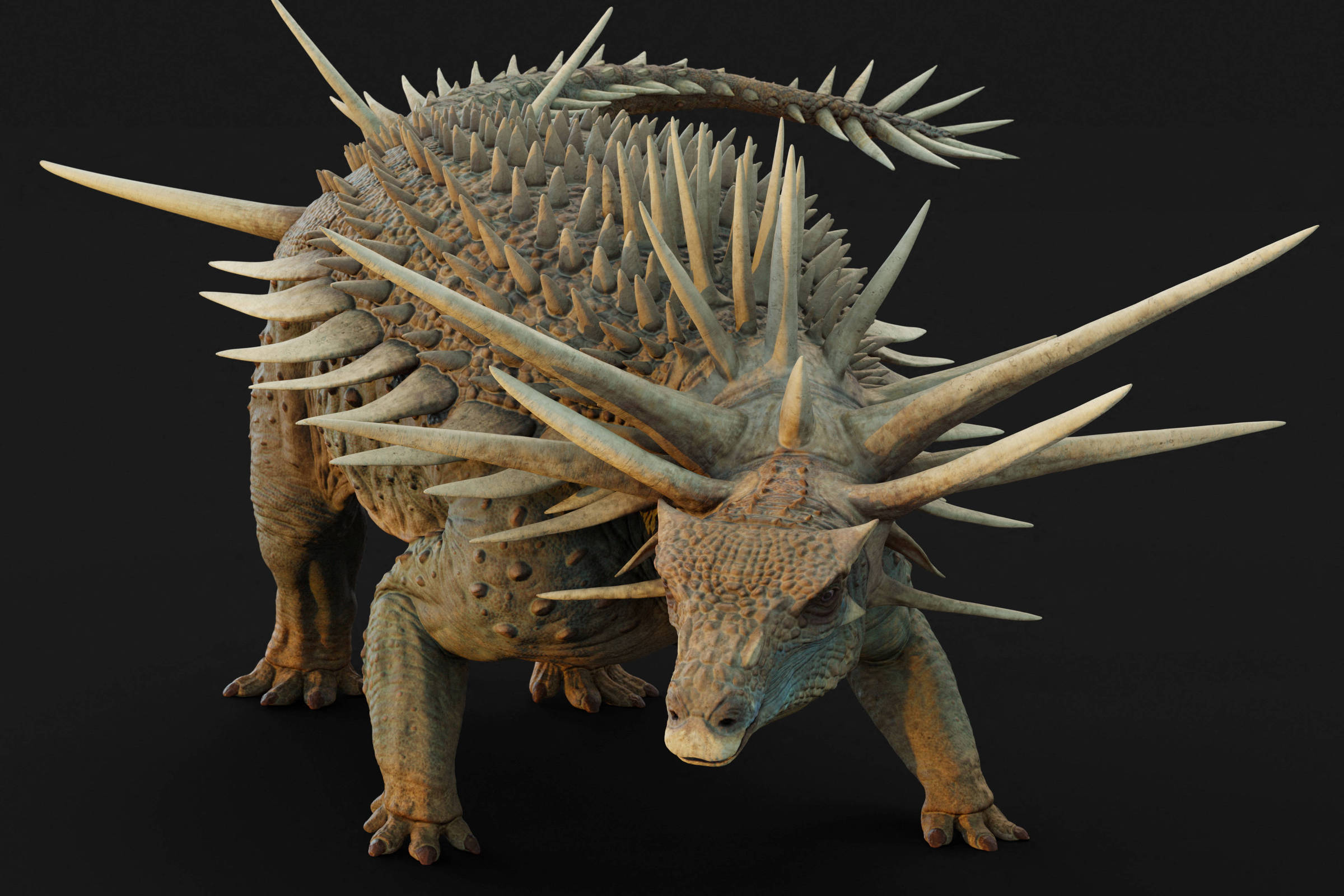 A imagem mostra um dinossauro pré-histórico com um corpo robusto e coberto de espinhos. Ele possui uma cabeça larga e chifres proeminentes, além de uma pele com textura rugosa. O fundo é preto, destacando a figura do dinossauro.