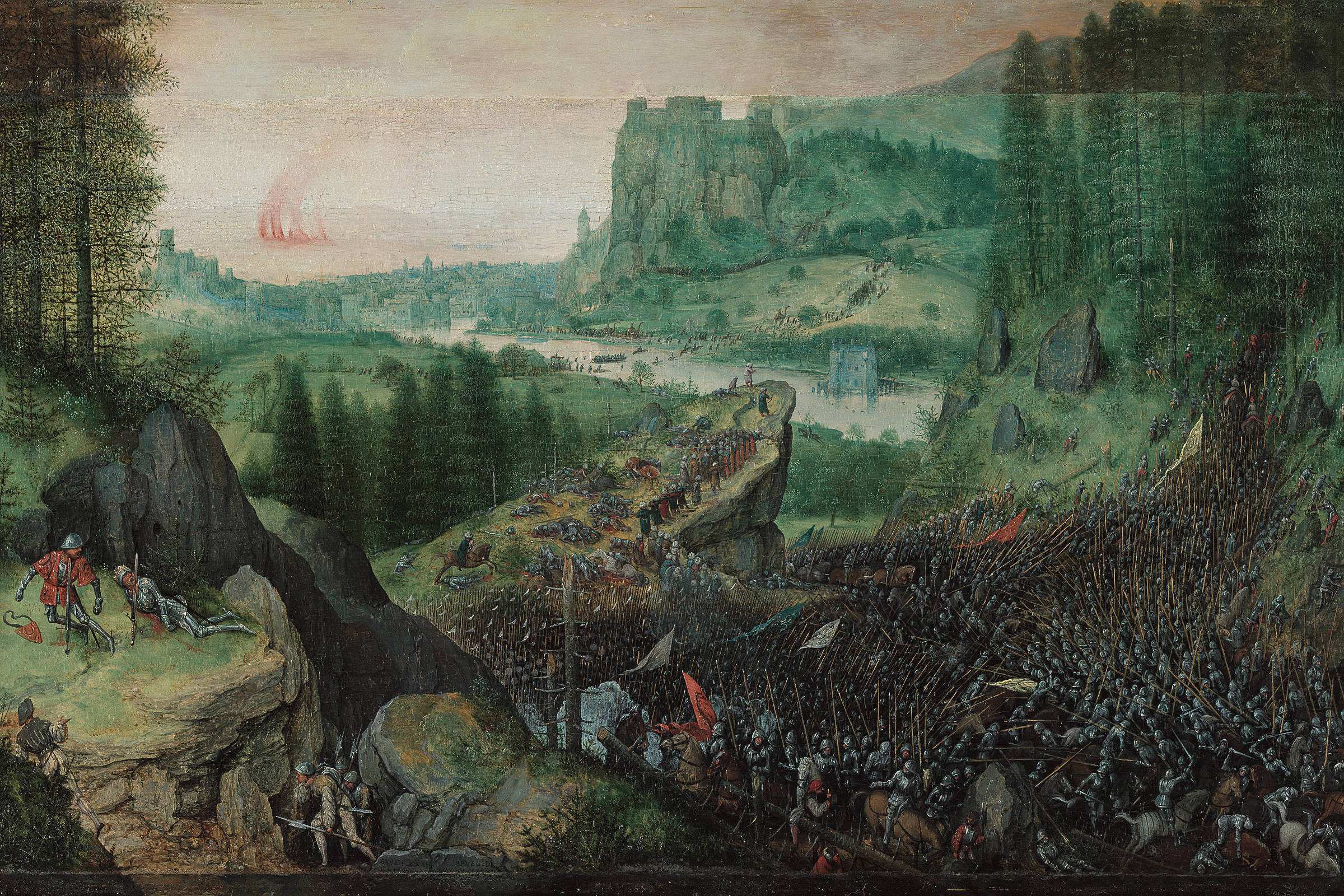 Cena de batalha medieval com dois grandes exércitos armados em confronto em terreno montanhoso e florestado. No fundo, um castelo sobre penhasco e uma cidade próxima a um rio. Soldados com lanças, bandeiras vermelhas e armaduras ocupam a maior parte da imagem, com cavalaria e infantaria em formação densa.